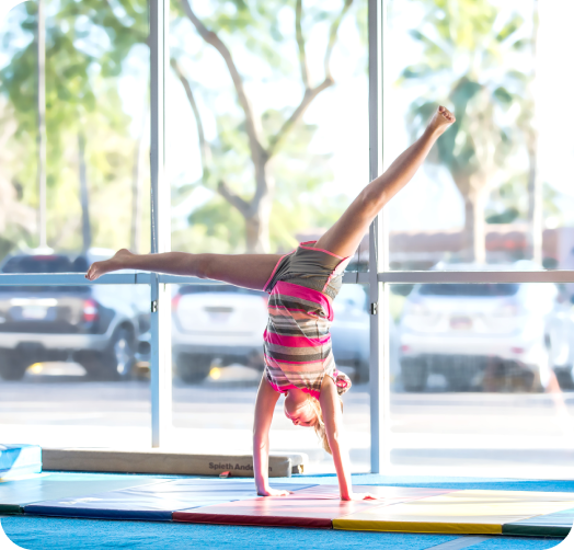 Child happily exercising in The Little Gym